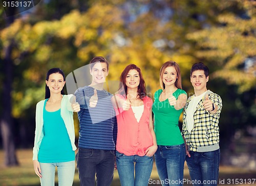 Image of group of smiling students showing thumbs up