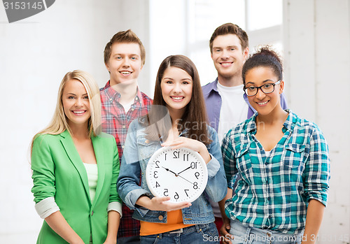 Image of group of students at school with clock