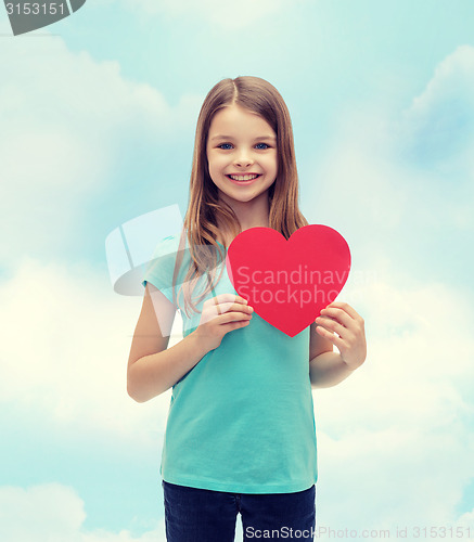 Image of smiling little girl with red heart