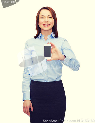 Image of smiling businesswoman with smartphone blank screen