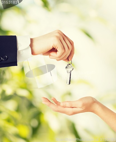 Image of man and woman with house keys