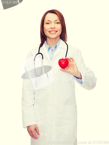 Image of smiling female doctor with heart and stethoscope