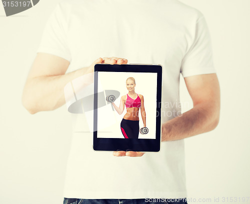 Image of man with tablet pc and sporty woman