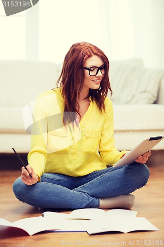 Image of student with tablet pc computer and notebooks