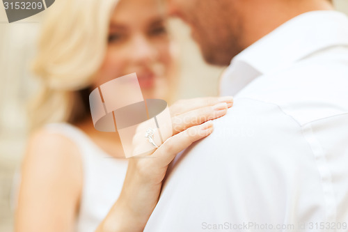 Image of romantic man proposing to beautiful woman