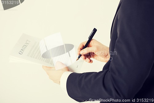 Image of man with contract