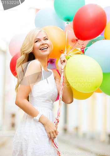 Image of woman with colorful balloons