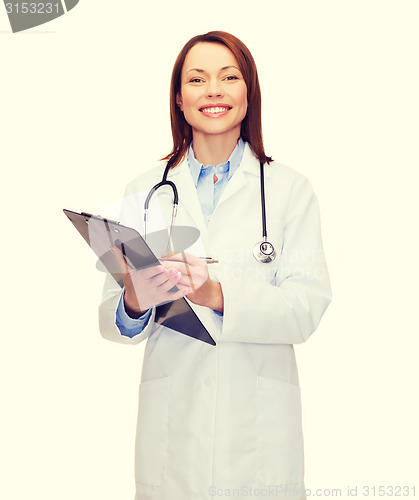 Image of smiling female doctor with clipboard