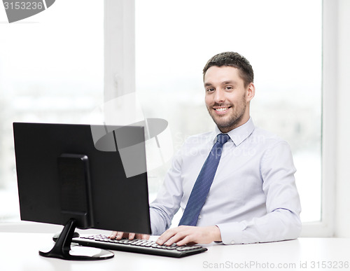 Image of smiling businessman or student with computer