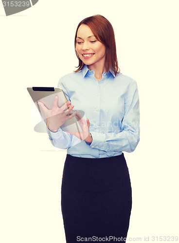 Image of smiling woman looking at tablet pc