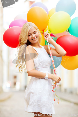 Image of woman with colorful balloons