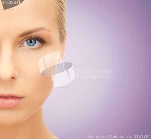 Image of close up of beautiful young woman half face