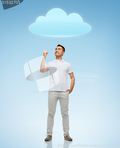 Image of smiling man pointing finger up to cloud
