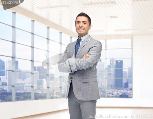 Image of happy smiling businessman in suit