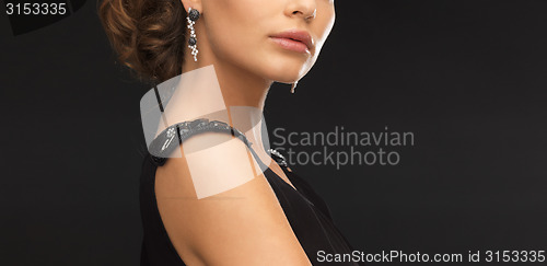 Image of woman with diamond earrings