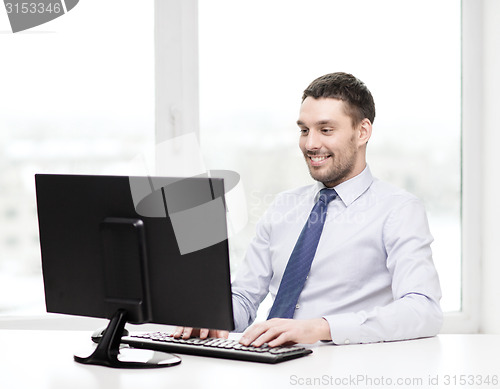 Image of smiling businessman or student with computer