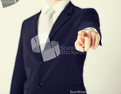 Image of man pointing his finger at you