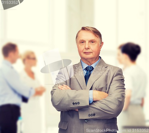 Image of serious businessman or teacher in suit