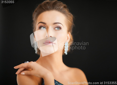 Image of woman with diamond earrings