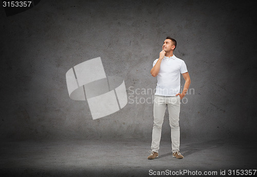 Image of smiling man with looking up and thinking