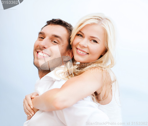 Image of couple having fun on the beach