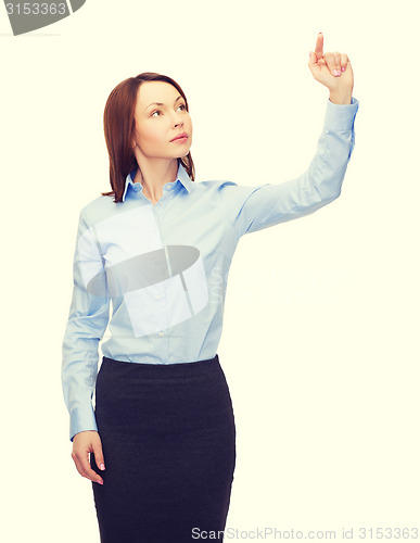 Image of calm businesswoman working with virtual screen