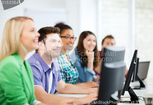 Image of students with computers studying at school