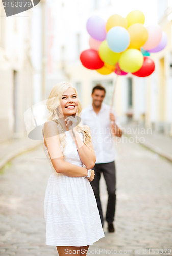 Image of couple with colorful balloons