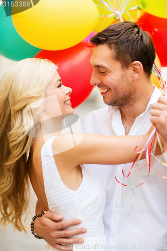 Image of couple with colorful balloons