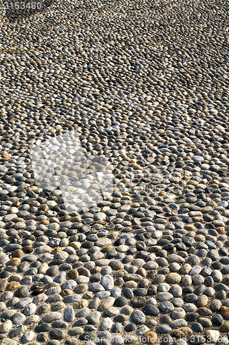Image of near mozzate street   varese abstract   pavement of a curch and 