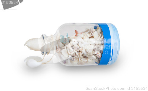 Image of Glass bottle filled with sea shells