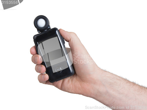 Image of Modern flash meter use by hand