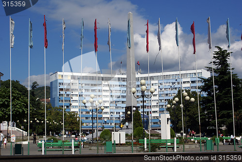 Image of Long building and flags