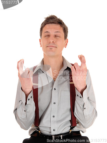 Image of Man crossing fingers