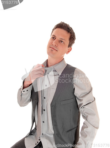 Image of Man taking of his tie.