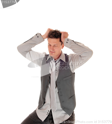 Image of Man scratching his head.