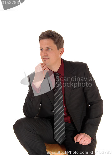 Image of Young businessman thinking.