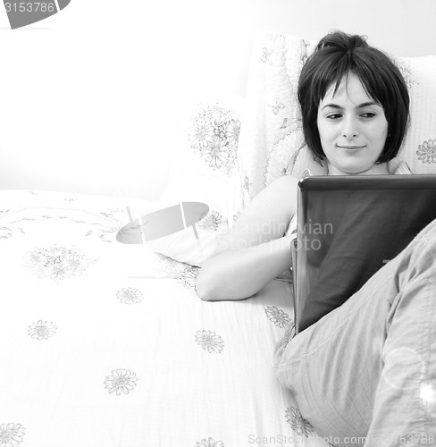 Image of Young woman with laptop 