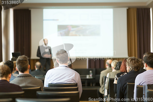 Image of Speaker at Business Conference and Presentation