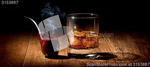 Image of Pipe and scotch