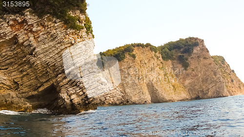 Image of Rocks over the transparent ocean water