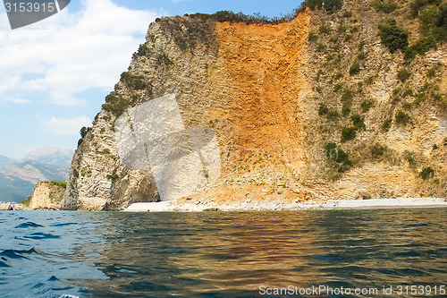Image of The rocks over the transparent ocean water. Montenegro