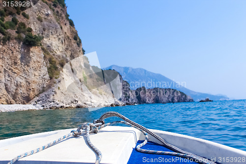 Image of boat floats near the shore.