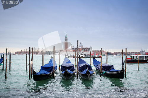 Image of Gondolas in water with view of San Giorgio Maggiore