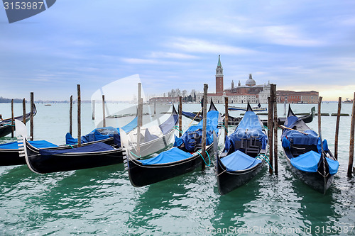 Image of Gondolas moored in front of San Giorgio Maggiore