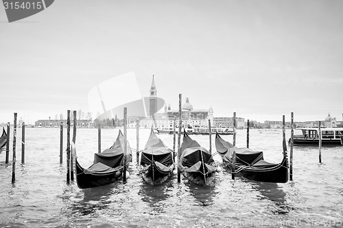 Image of Gondolas with view of San Giorgio Maggiore bw