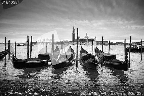 Image of San Giorgio Maggiore church with moored gondolas bw