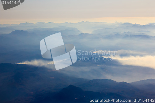Image of White clouds in blue sky. Aerial view from airplane.