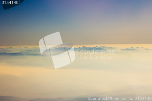 Image of White clouds in blue sky. Aerial view from airplane.