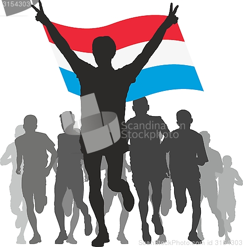 Image of Winner with the Luxembourg flag at the finish